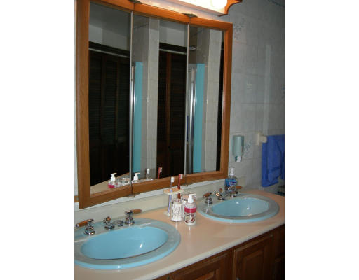 541 Reservoir Road Lunenburg, MA 01462 - Photo 12 of 24 a bathroom with a sink and a mirror