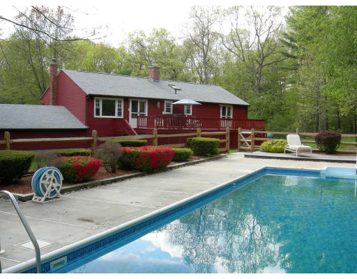 541 Reservoir Road Lunenburg, MA 01462 - Photo 14 of 24 a front view of a house with garden