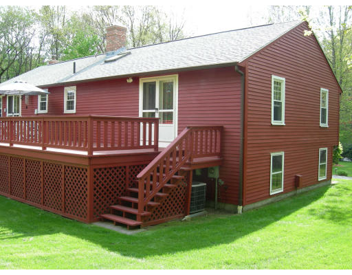 541 Reservoir Road Lunenburg, MA 01462 - Photo 16 of 24 a view of a house with a yard and deck
