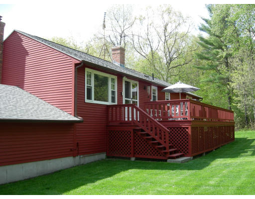 541 Reservoir Road Lunenburg, MA 01462 - Photo 2 of 24 a view of a wooden deck and a yard