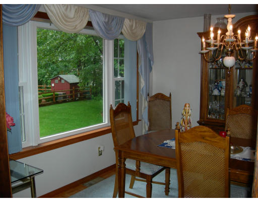 541 Reservoir Road Lunenburg, MA 01462 - Photo 22 of 24 a dining room with furniture and window