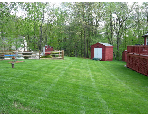 541 Reservoir Road Lunenburg, MA 01462 - Photo 3 of 24 a view of a backyard with sitting area