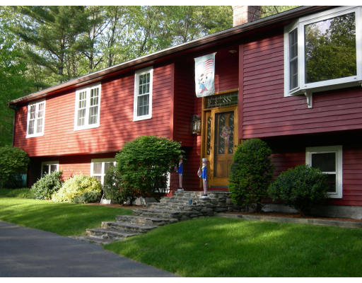 541 Reservoir Road Lunenburg, MA 01462 - Photo 5 of 24 a front view of a house with a yard