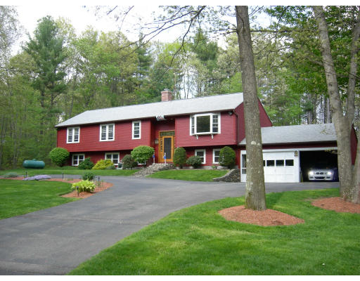 541 Reservoir Road Lunenburg, MA 01462 - Photo 8 of 24 a front view of a house with garden