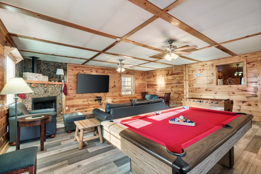 2617 Sharpes Ridge Way Sevierville, TN 37876 - Photo 12 of 43 a room with pool table a flat screen tv and windows