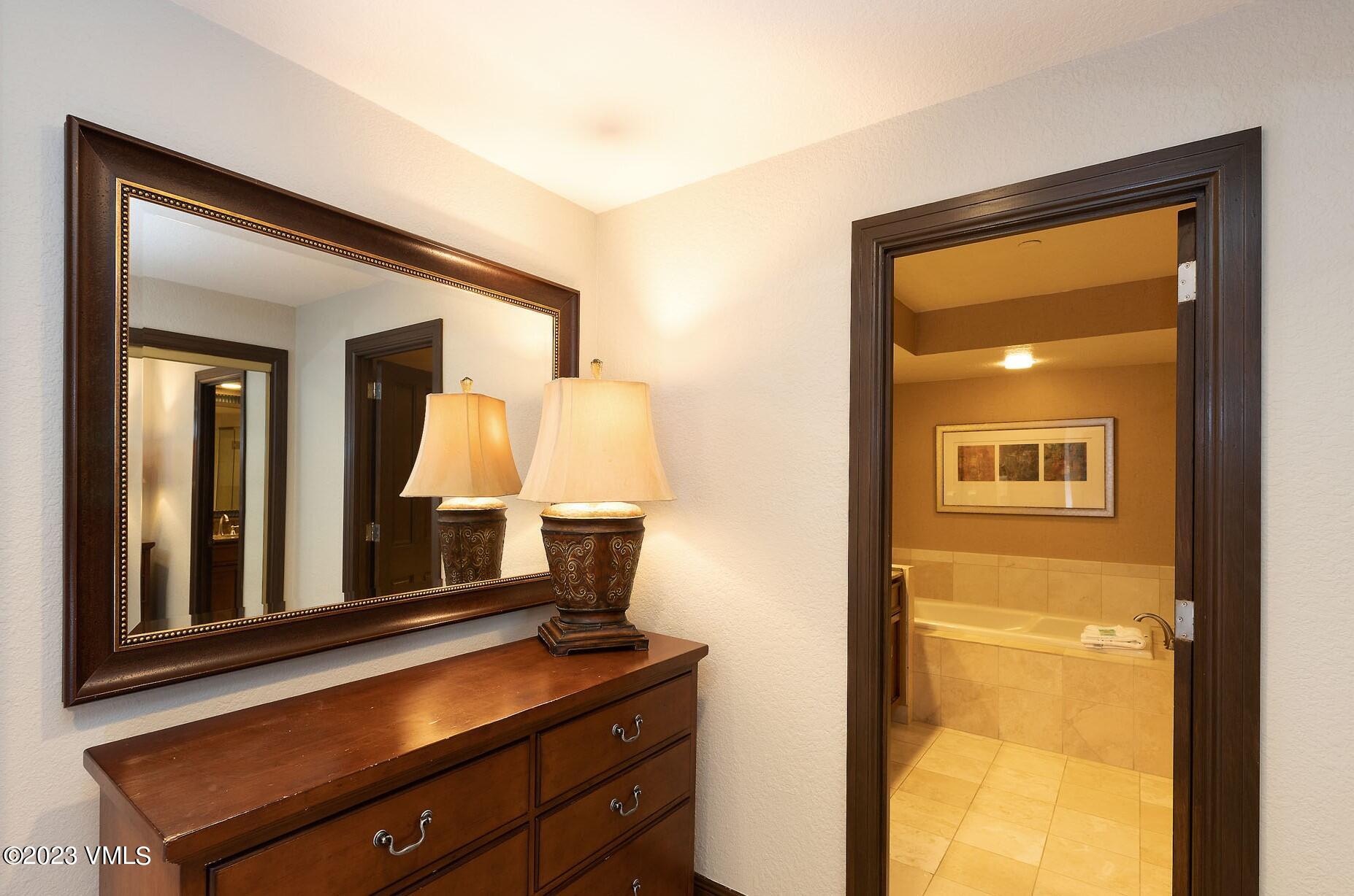 210 Offerson Road, Unit R408 WEEKS 33/34/35 Beaver Creek, CO 81620 - Photo 13 of 28 a bathroom with a sink and a mirror