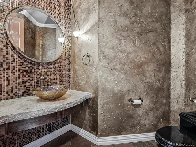 a kitchen with stainless steel appliances granite countertop a refrigerator and a stove