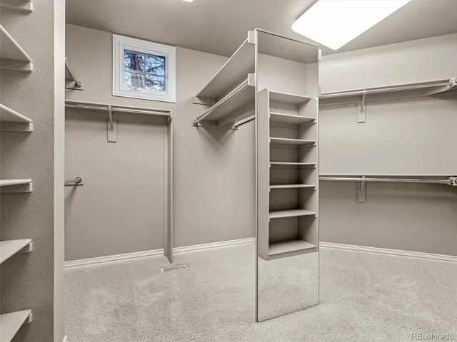 a view of a hallway with a livingroom and a fireplace