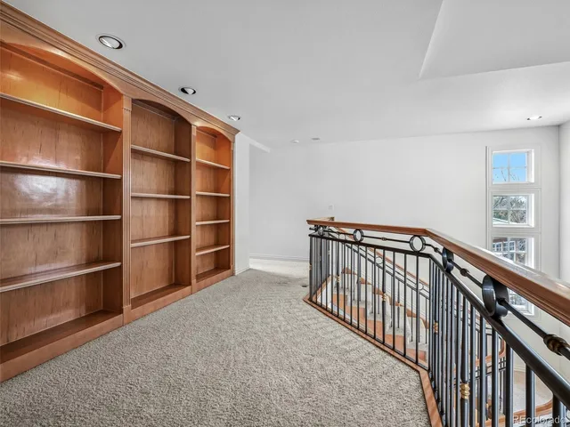 a view of a livingroom with a ceiling fan and window
