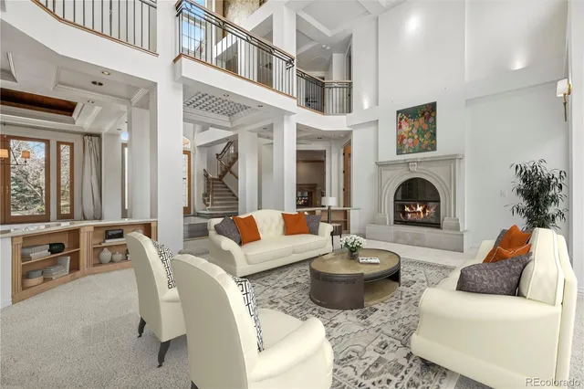 a living room with furniture fireplace and a fireplace