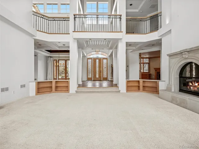 a kitchen with granite countertop a sink a stove and cabinets
