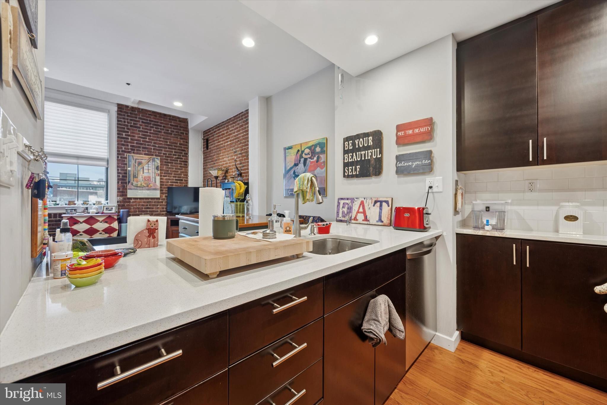 315 New Street, Unit 417 Philadelphia, PA 19106 - Photo 12 of 29 a view of kitchen sink and wooden floor