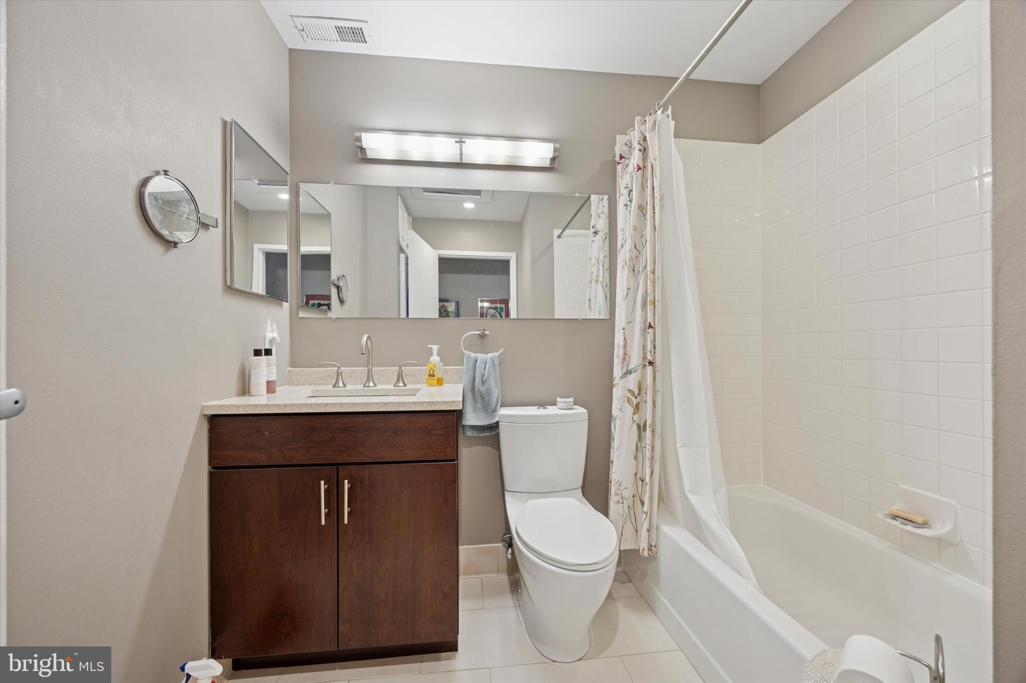 315 New Street, Unit 417 Philadelphia, PA 19106 - Photo 13 of 29 a bathroom with a sink a toilet and shower