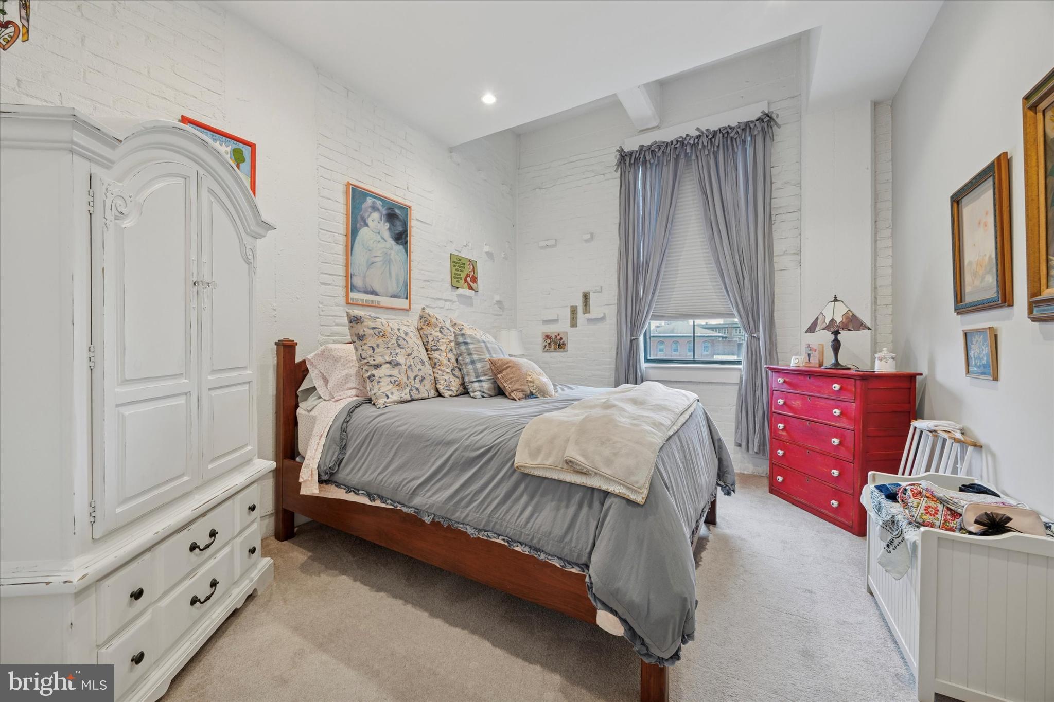 315 New Street, Unit 417 Philadelphia, PA 19106 - Photo 19 of 29 a bedroom with a bed and a window