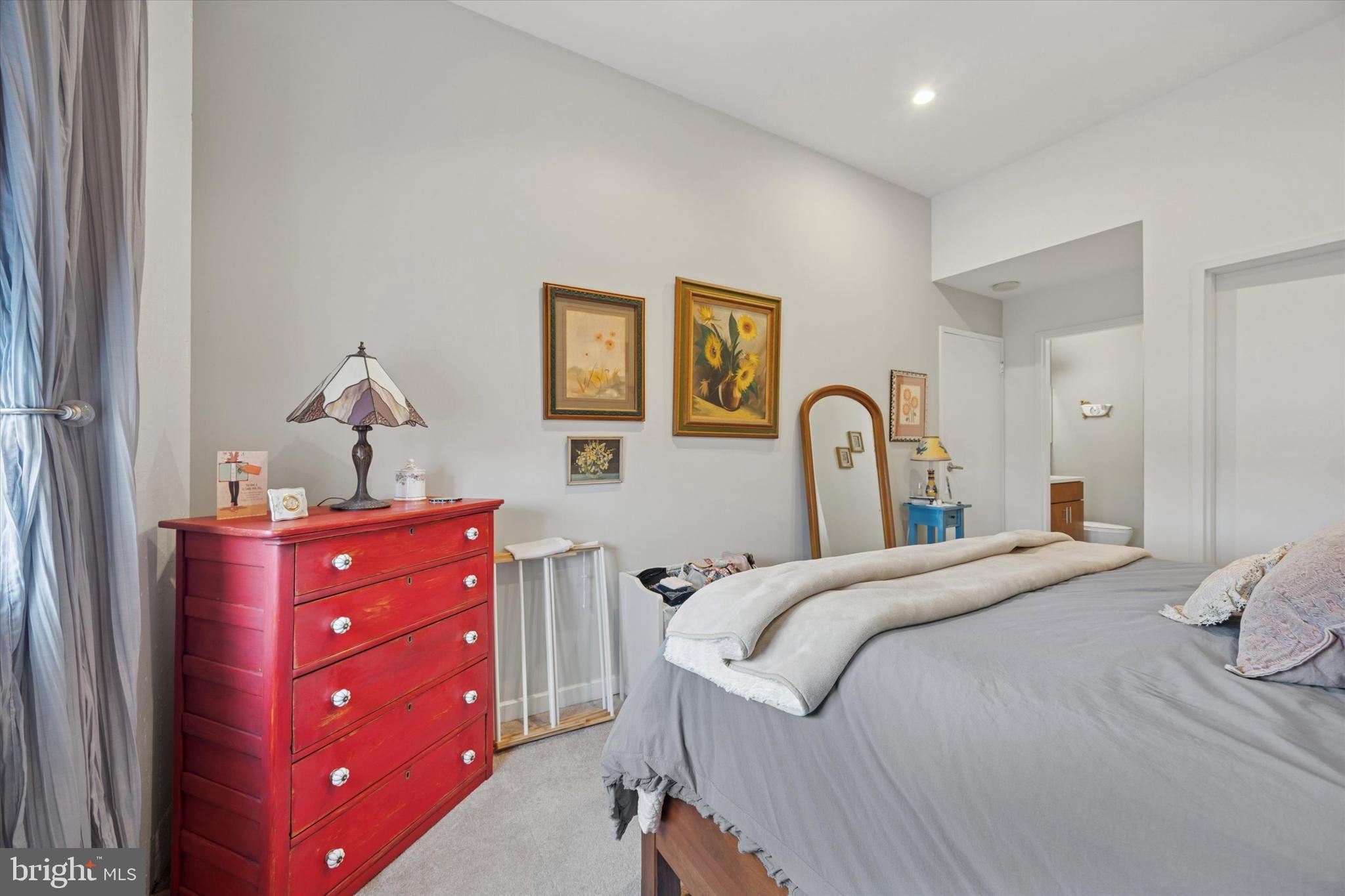 315 New Street, Unit 417 Philadelphia, PA 19106 - Photo 21 of 29 a bedroom with a bed and a dresser