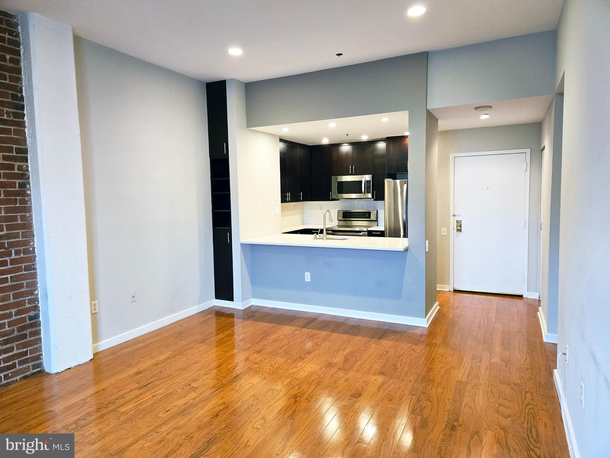 315 New Street, Unit 417 Philadelphia, PA 19106 - Photo 8 of 29 a view of kitchen and kitchen with a sink