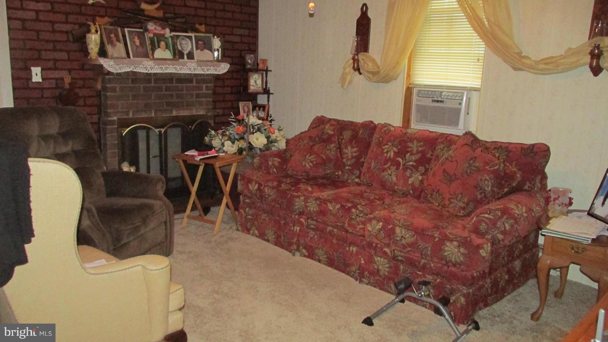 7311 Chesapeake Road Baltimore, MD 21220 - Photo 7 of 14 LIVING ROOM (W/ FIREPLACE)