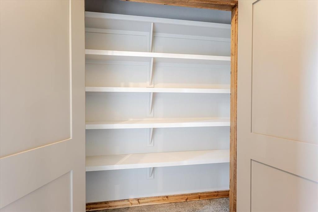 11 Maverick Loop Granbury, TX 76048 - Photo 14 of 27 a view of walk in closet with empty racks