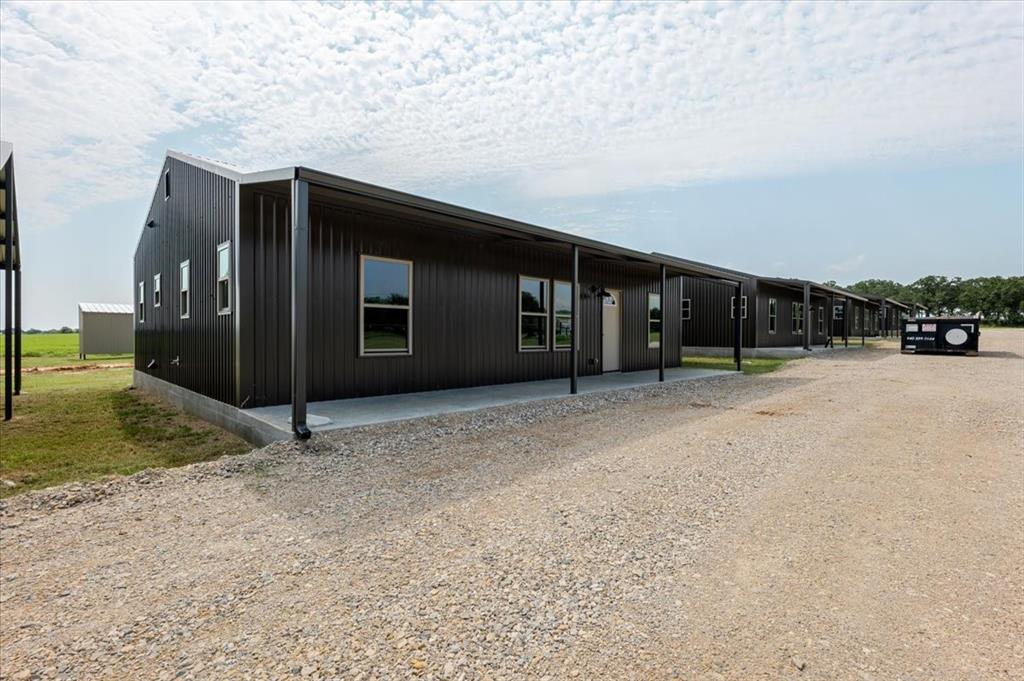 11 Maverick Loop Granbury, TX 76048 - Photo 2 of 27 a view of a house with a wooden fence