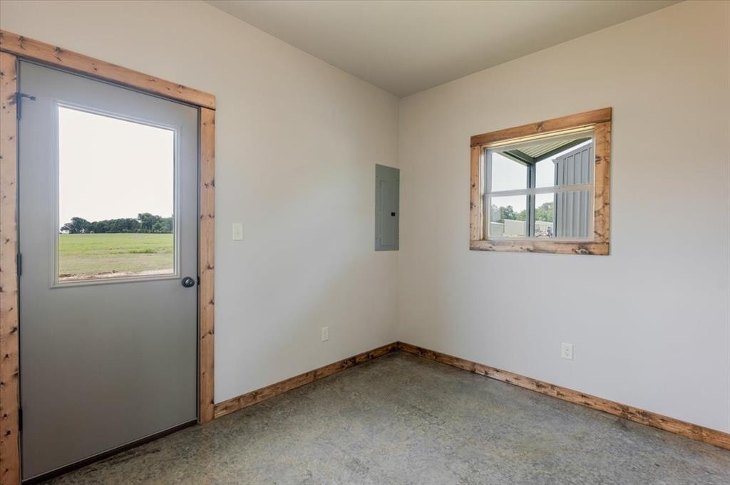 11 Maverick Loop Granbury, TX 76048 - Photo 22 of 27 an empty room with a window