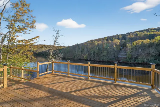 a view of a house with wooden deck