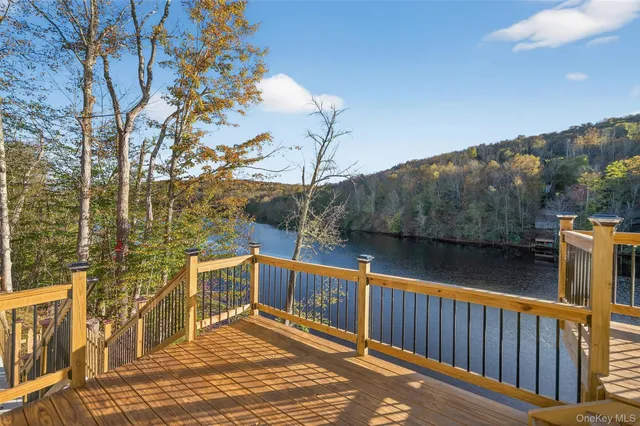a view of a house with wooden deck