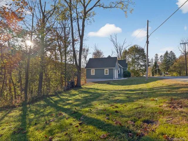 a large pool with lawn chairs yard