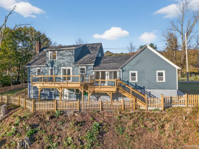 an aerial view of a house with a lake view