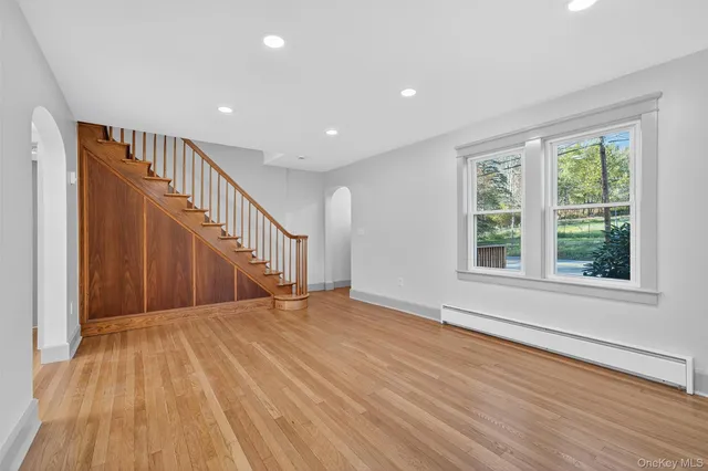 a view of entryway with wooden floor
