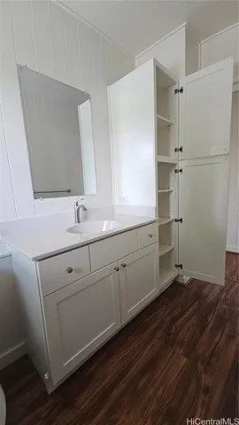 a bathroom with a sink and mirror