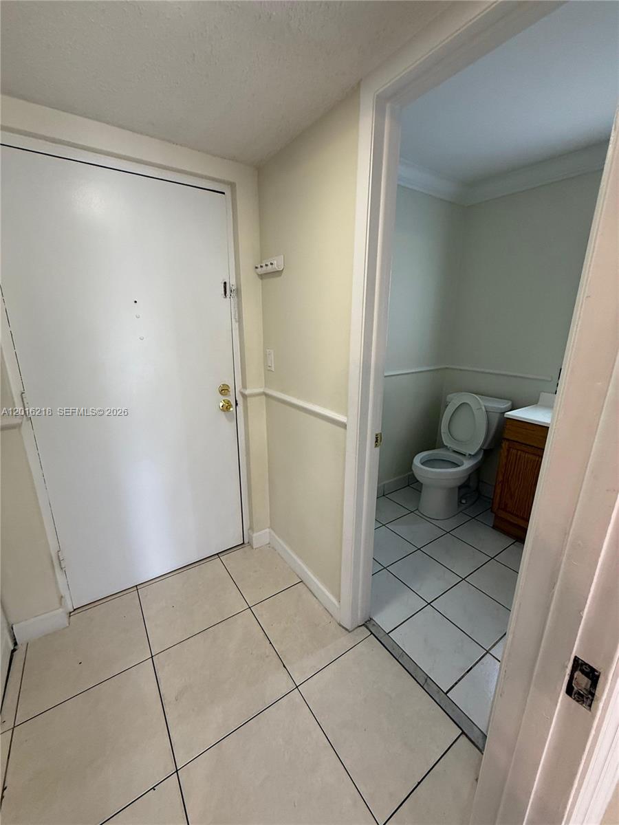 9321 Southwest 4th Street, Unit 230C Miami, FL 33174 - Photo 6 of 37 a bathroom with a shower and a toilet