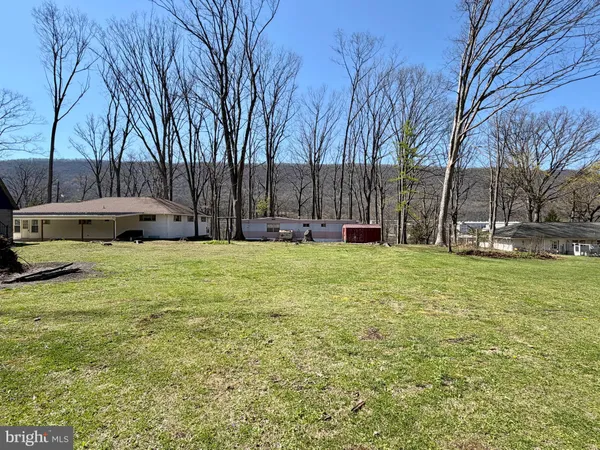 a view of a swimming pool with a house