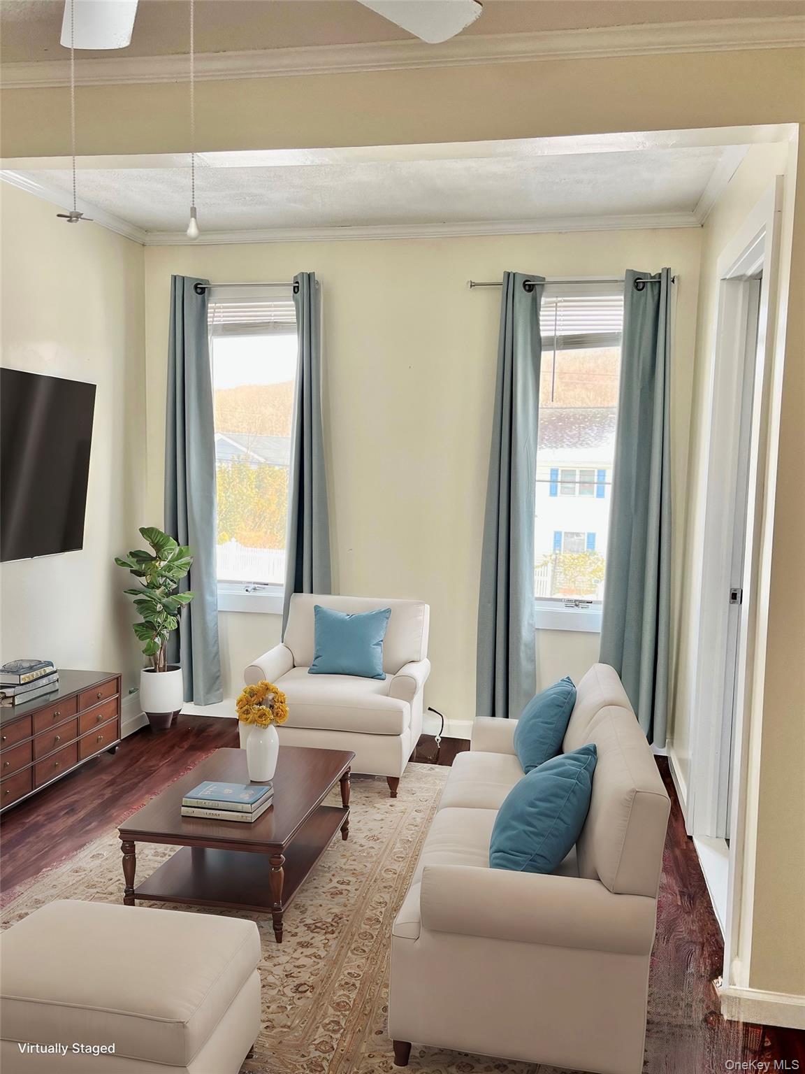 72 Lakeside Road Mahopac, NY 10541 - Photo 15 of 31 STAGED Living area with crown molding, baseboards, and wood finished floors