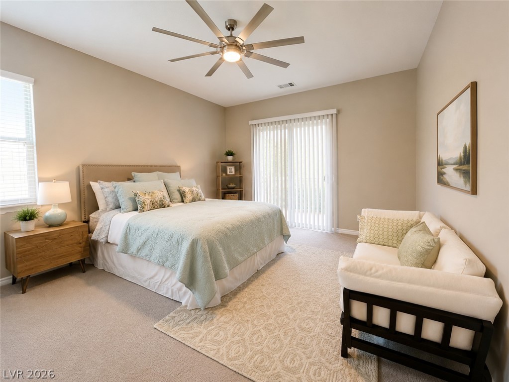 9724 University Ridge Avenue Las Vegas, NV 89149 - Photo 14 of 61 An inviting sleeping space with high vaulted ceilings and a private patio entrance.