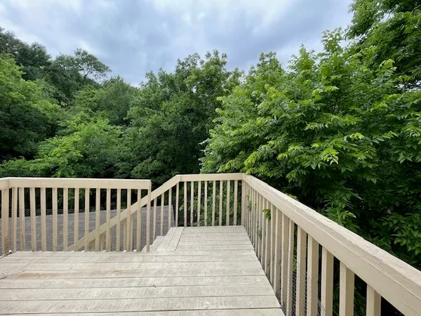 a balcony with wooden floor