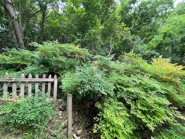 a view of house with trees in a background