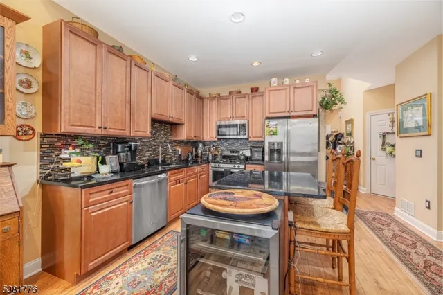 a dining room with furniture and a book shelf