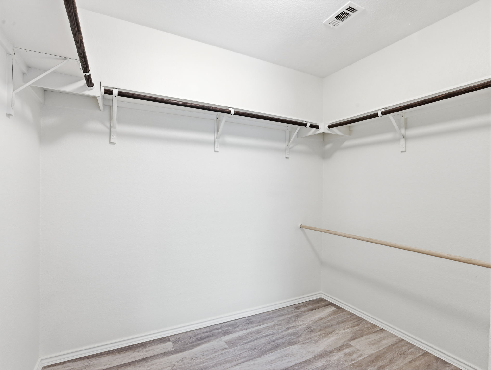 5900 Bell Tower Lane Austin, TX 78747 - Photo 11 of 26 Walk in closet with light wood-style floors
