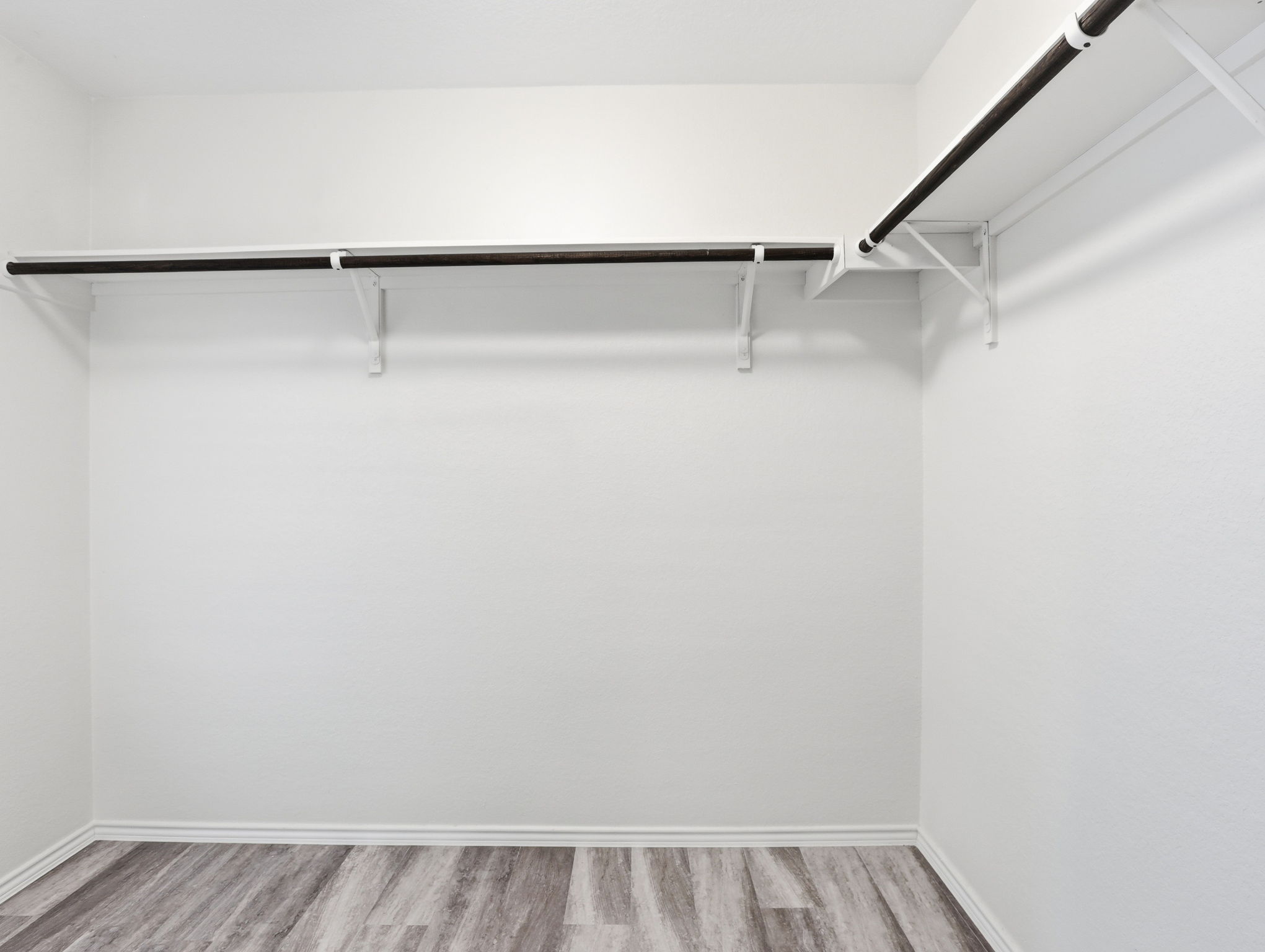5900 Bell Tower Lane Austin, TX 78747 - Photo 13 of 26 Walk in closet with light wood finished floors