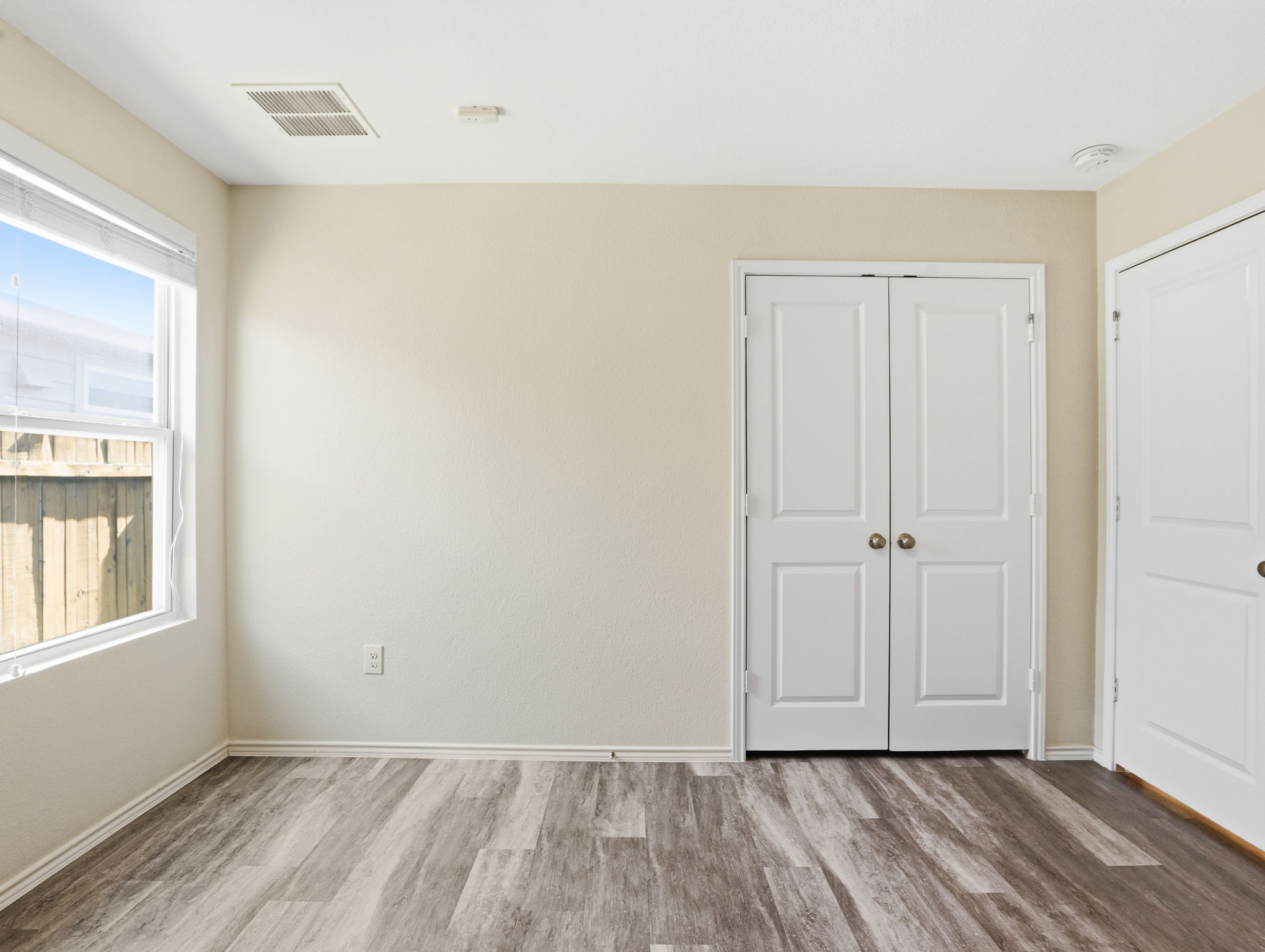 5900 Bell Tower Lane Austin, TX 78747 - Photo 18 of 26 Unfurnished bedroom with light wood-style flooring and a closet