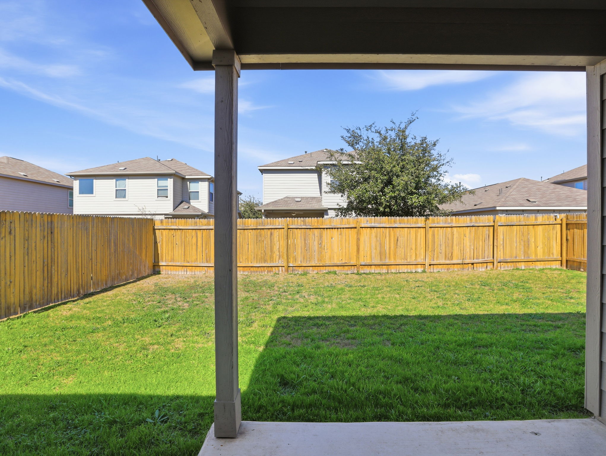 5900 Bell Tower Lane Austin, TX 78747 - Photo 21 of 26 Fenced backyard featuring a patio and a residential view