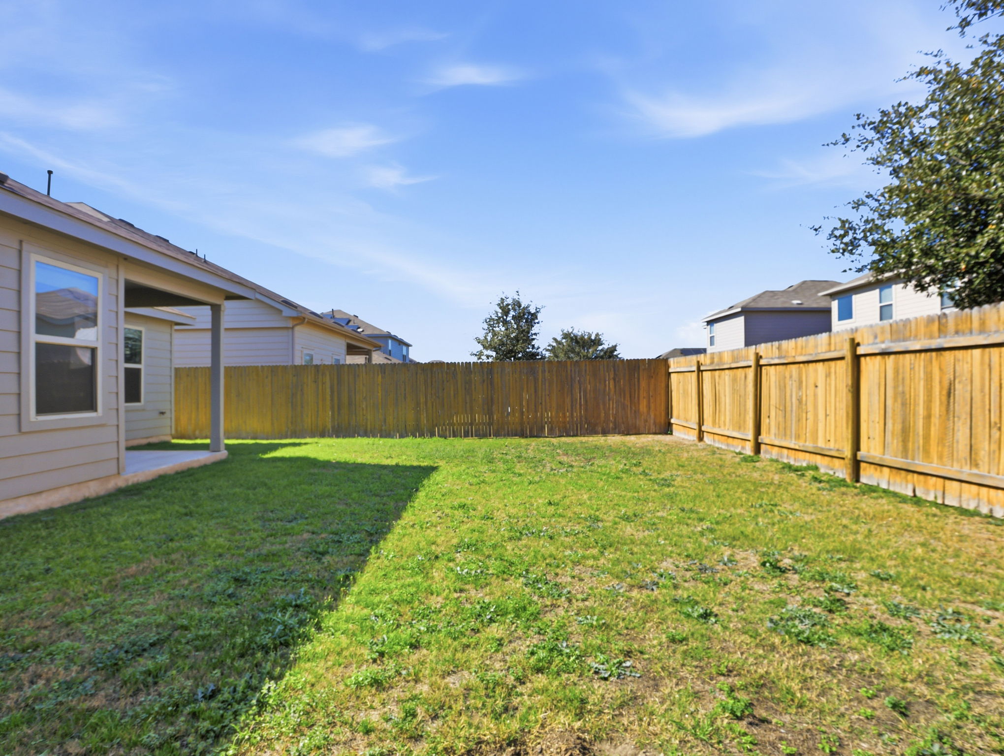 5900 Bell Tower Lane Austin, TX 78747 - Photo 23 of 26 Fenced backyard featuring a patio