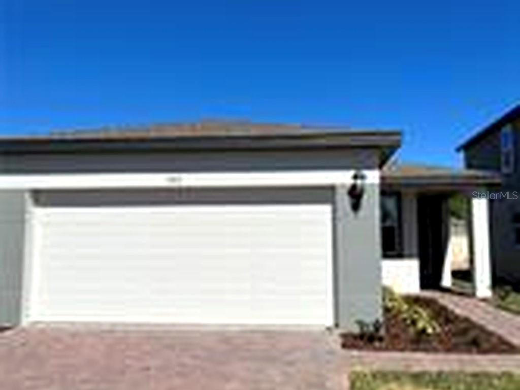 a view of a house with a small yard