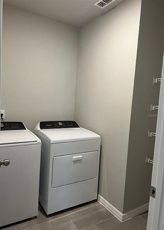 953 Rivers Crossing Street Clermont, FL 34714 - Photo 11 of 22 a utility room with dryer and washer