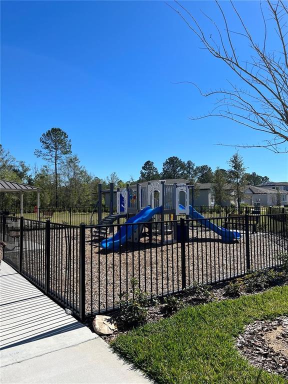 953 Rivers Crossing Street Clermont, FL 34714 - Photo 18 of 22 a view of a wrought iron fences in front of house
