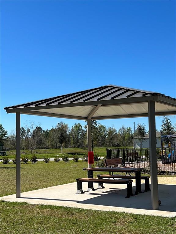 953 Rivers Crossing Street Clermont, FL 34714 - Photo 20 of 22 a view of a swimming pool with sitting area
