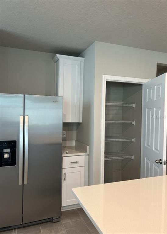 953 Rivers Crossing Street Clermont, FL 34714 - Photo 7 of 22 a kitchen with stainless steel appliances a refrigerator and a stove