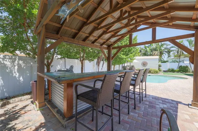 a view of an outdoor sitting area with furniture