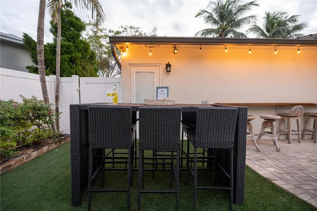 a outdoor dining space with furniture and outdoor view
