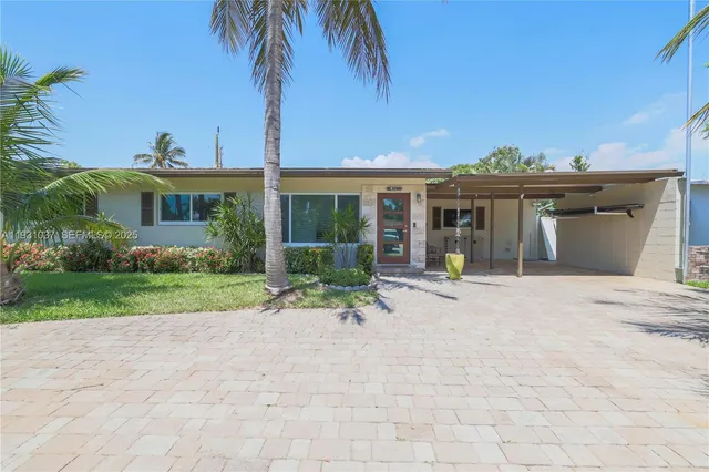 a house view with a garden space